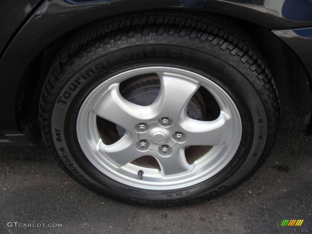 2004 Taurus SE Sedan - Black / Medium Parchment photo #7
