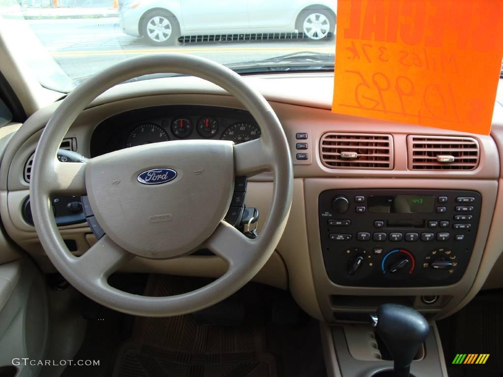 2004 Taurus SE Sedan - Black / Medium Parchment photo #16