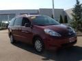 2009 Salsa Red Pearl Toyota Sienna LE  photo #7