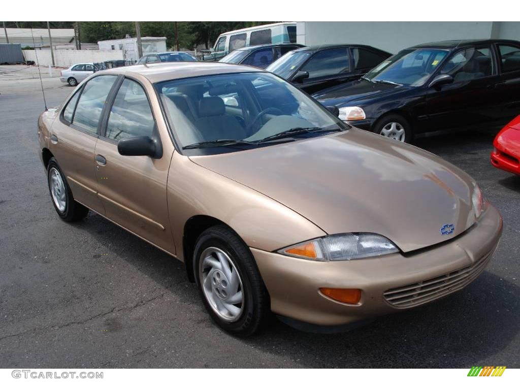 1999 Cavalier Sedan - Medium Sunset Gold Metallic / Graphite photo #1