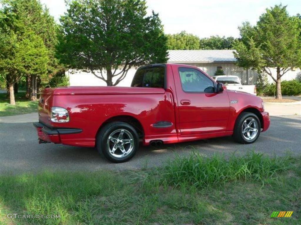2004 F150 SVT Lightning - Bright Red / SVT Black/Light Flint photo #2