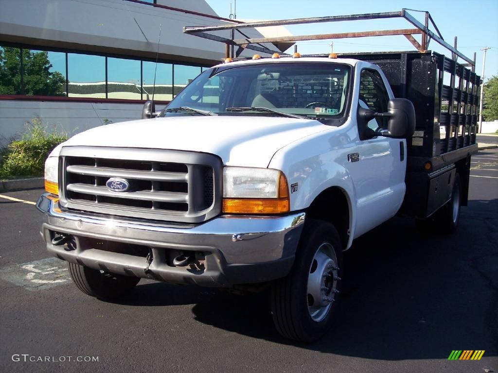 1999 F450 Super Duty XL Regular Cab Dually Chassis Stake Truck - Oxford White / Medium Graphite photo #7