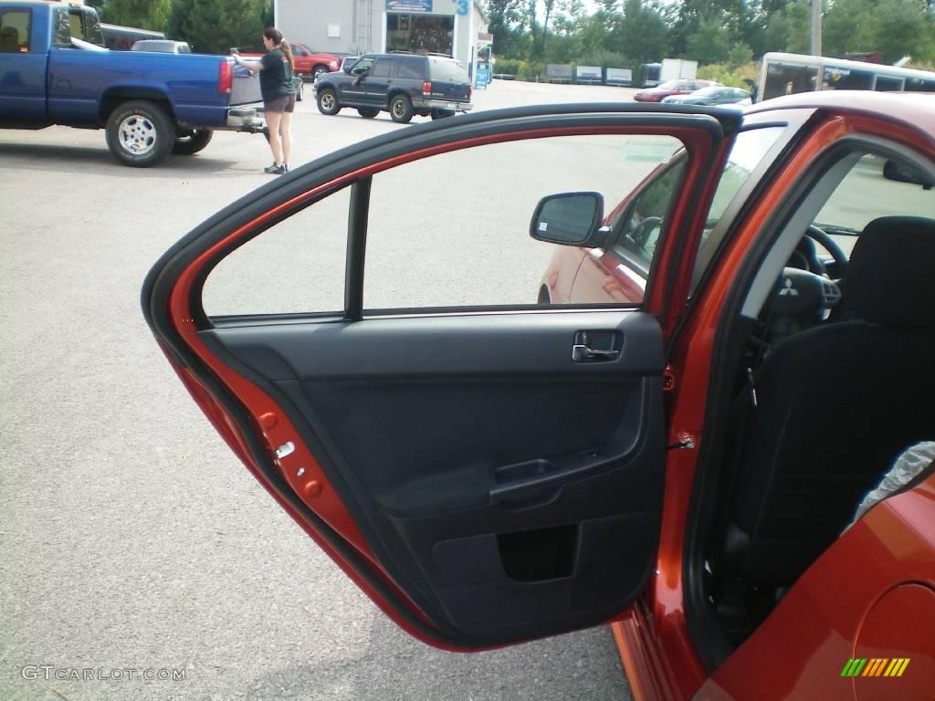 2010 Lancer GTS - Rotor Glow Orange Metallic / Black photo #17