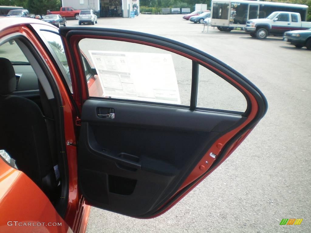 2010 Lancer GTS - Rotor Glow Orange Metallic / Black photo #21
