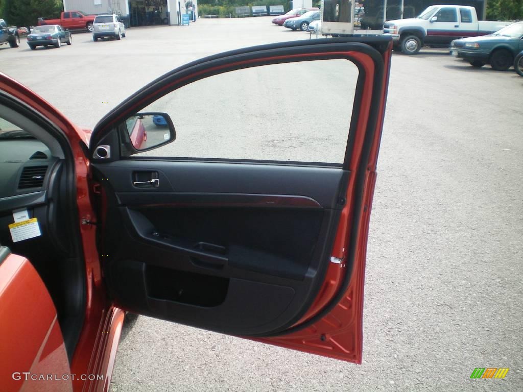 2010 Lancer GTS - Rotor Glow Orange Metallic / Black photo #23