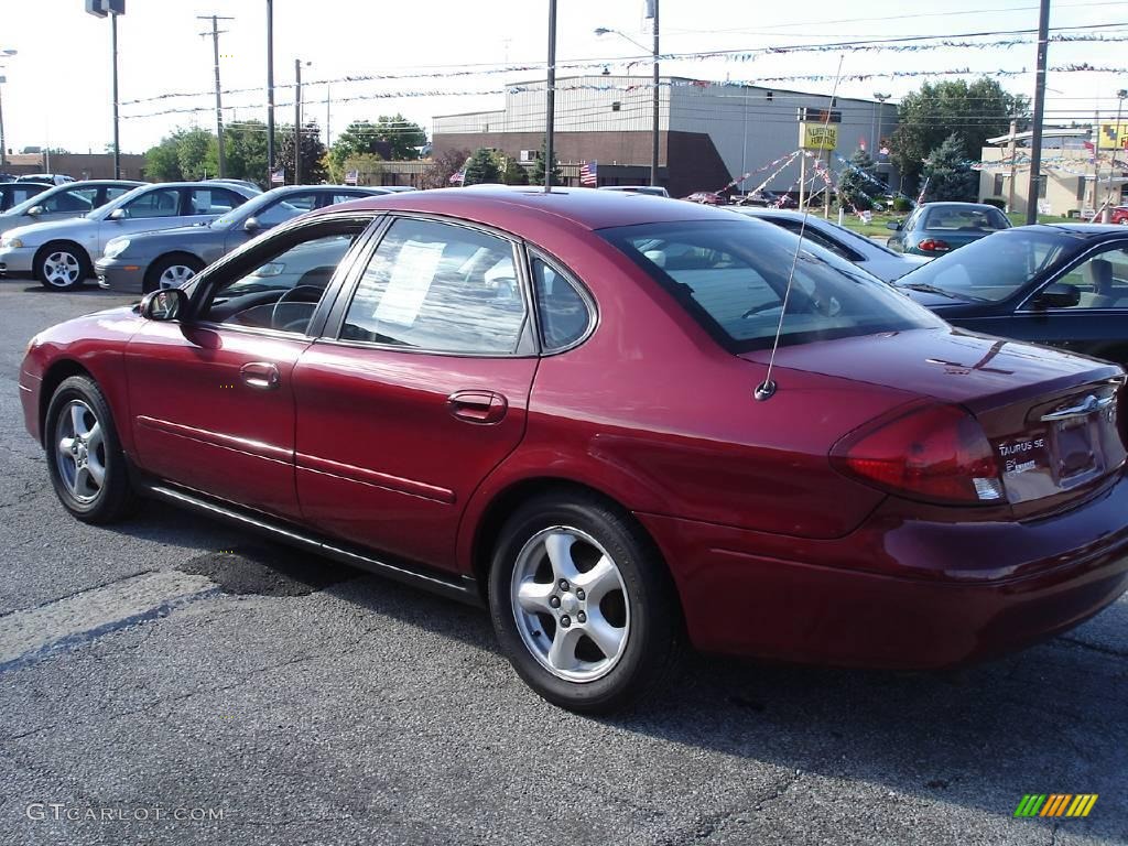 2002 Taurus SE - Matador Red Metallic / Medium Graphite photo #6