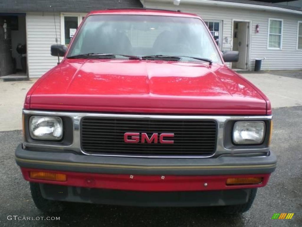 Bright Red GMC Jimmy