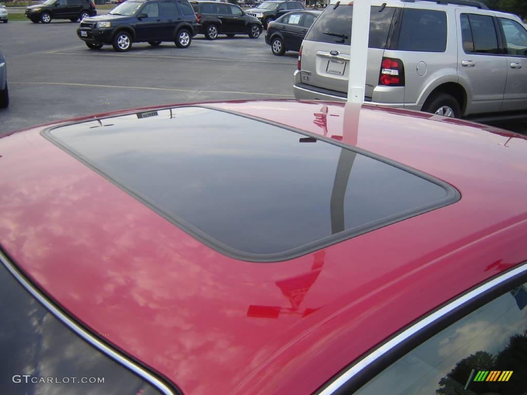 2003 Solara SLE V6 Coupe - Red Flame Metallic / Ivory photo #9