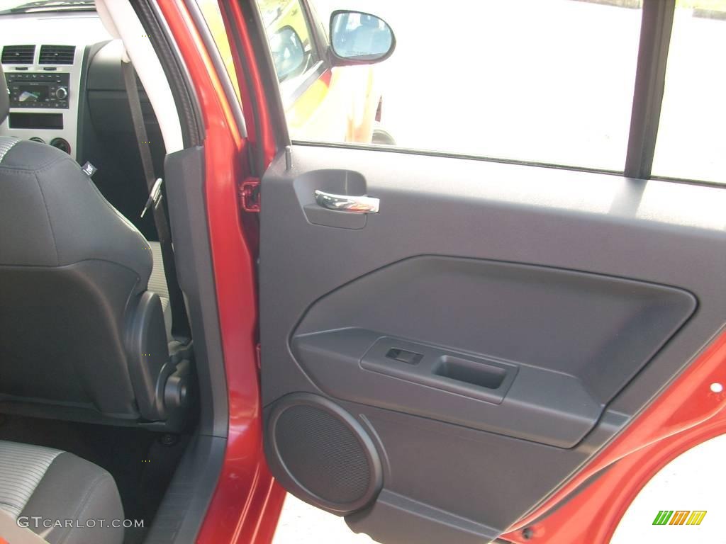 2009 Caliber SXT - Sunburst Orange Pearl / Dark Slate Gray photo #14