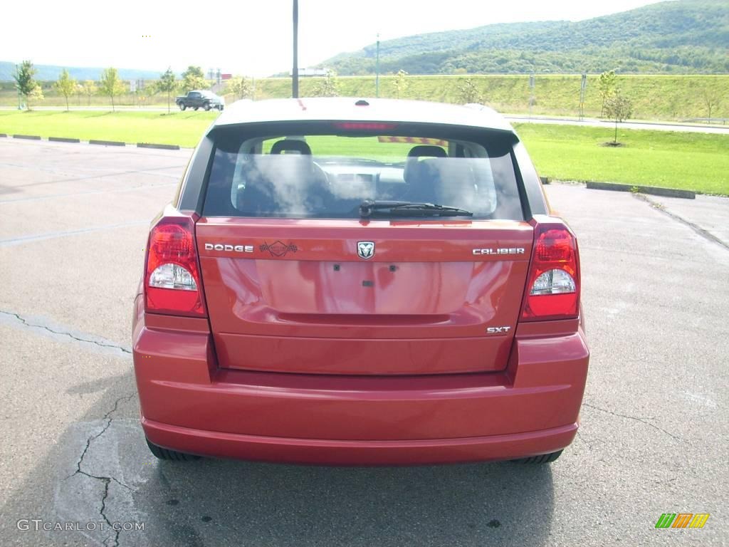 2009 Caliber SXT - Sunburst Orange Pearl / Dark Slate Gray photo #16