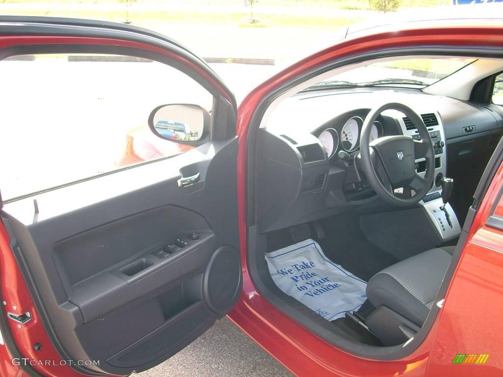 2009 Caliber SXT - Sunburst Orange Pearl / Dark Slate Gray photo #23