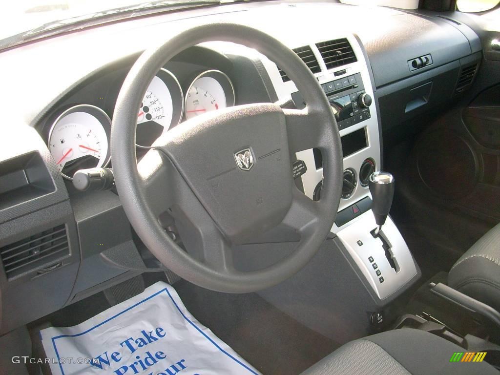 2009 Caliber SXT - Sunburst Orange Pearl / Dark Slate Gray photo #25