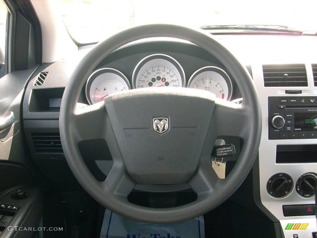 2009 Caliber SXT - Sunburst Orange Pearl / Dark Slate Gray photo #26