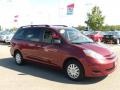 2009 Salsa Red Pearl Toyota Sienna LE  photo #7