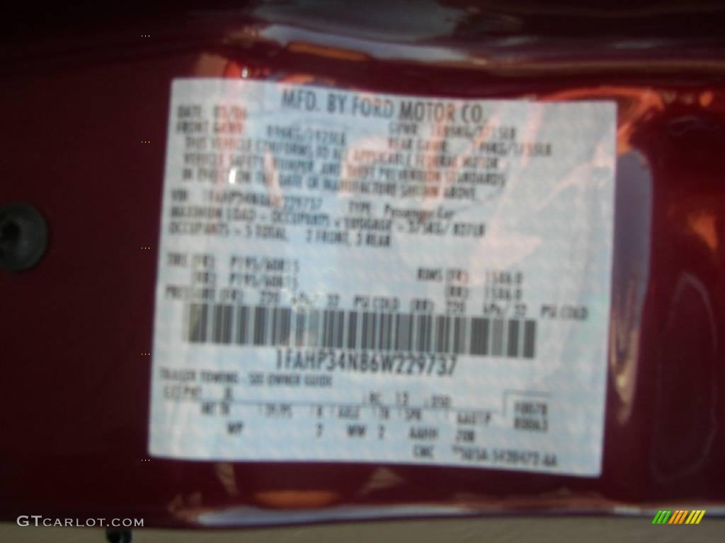 2006 Focus ZX4 SE Sedan - Dark Toreador Red Metallic / Dark Flint/Light Flint photo #10