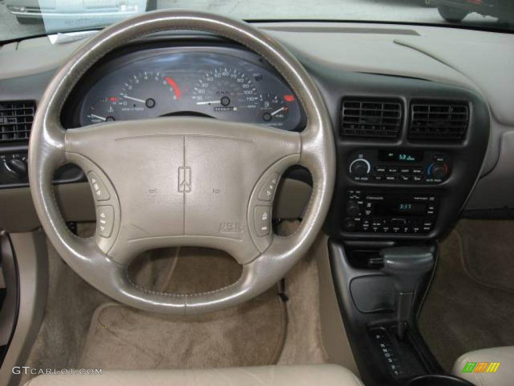 1997 Cutlass Supreme SL Sedan - Light Sandrift Metallic / Beige photo #3