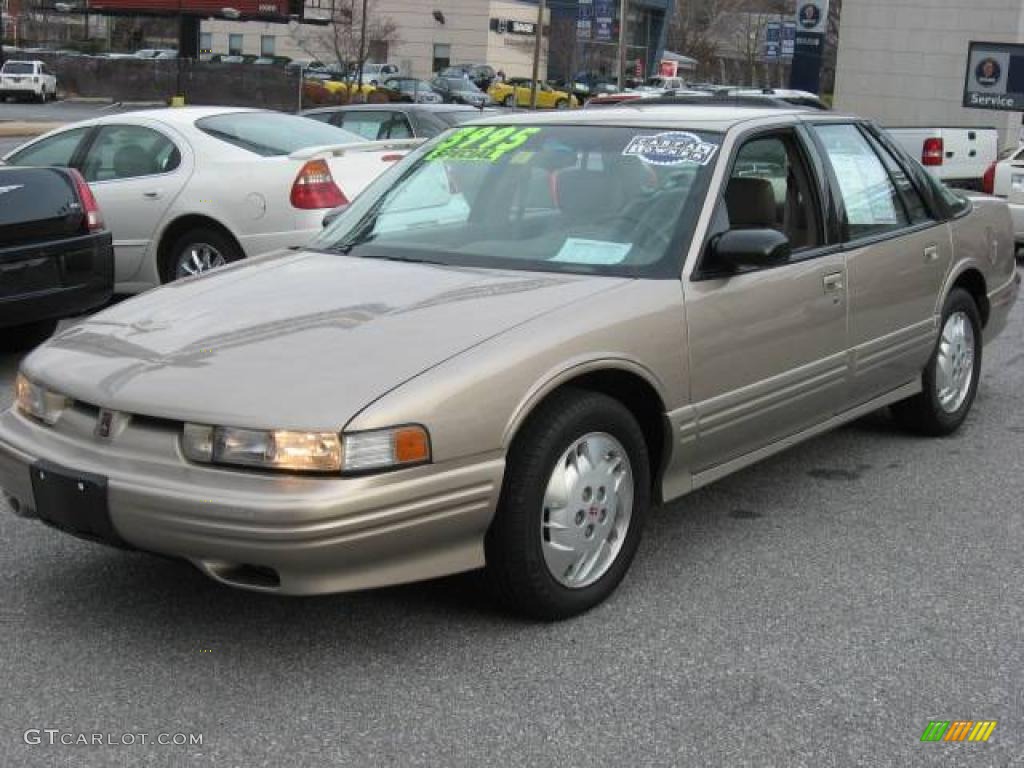 1997 Cutlass Supreme SL Sedan - Light Sandrift Metallic / Beige photo #5