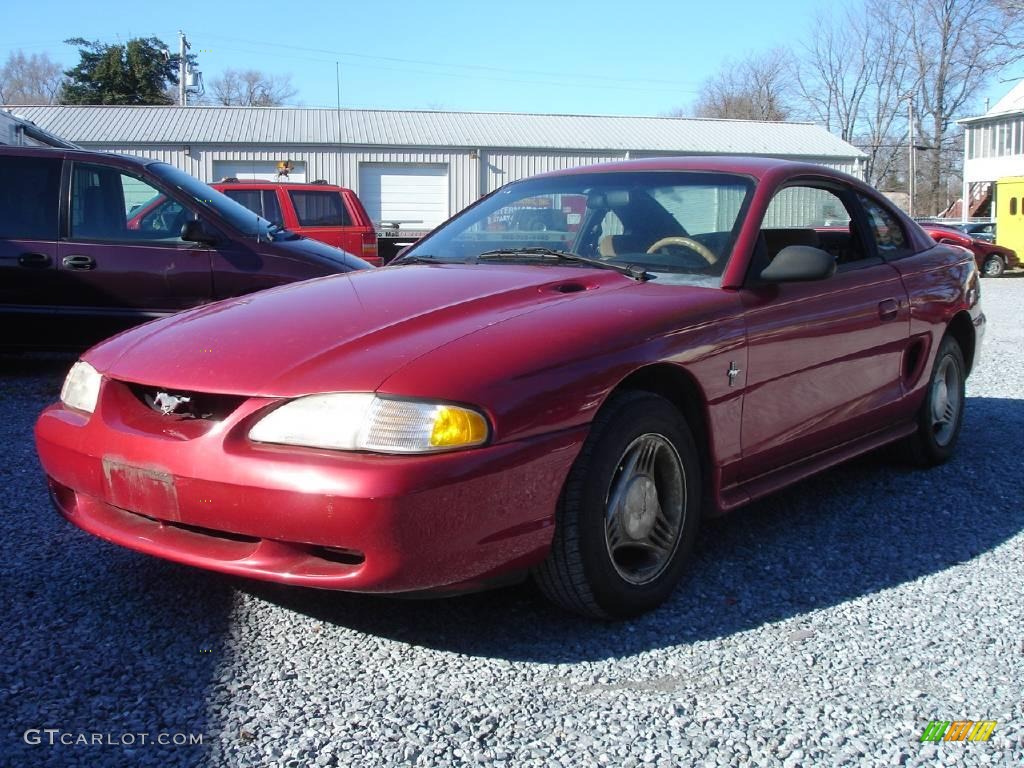 1995 Mustang V6 Coupe - Laser Red Metallic / Saddle photo #1