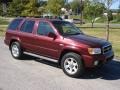 2004 Merlot Red Pearl Nissan Pathfinder LE Platinum 4x4  photo #1