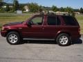 2004 Merlot Red Pearl Nissan Pathfinder LE Platinum 4x4  photo #7