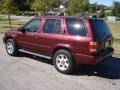 2004 Merlot Red Pearl Nissan Pathfinder LE Platinum 4x4  photo #8