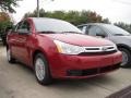 2010 Sangria Red Metallic Ford Focus SE Sedan  photo #2