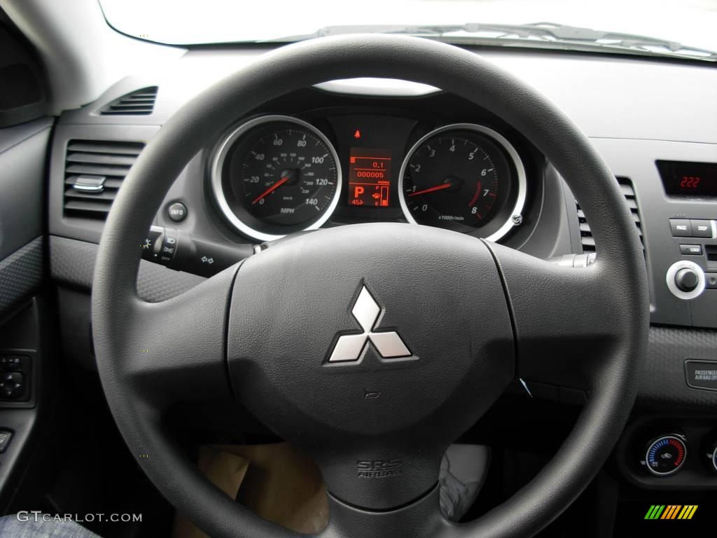 2010 Lancer DE - Wicked White Metallic / Black photo #5