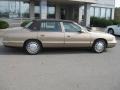 1999 Gold Firemist Cadillac DeVille Sedan  photo #2