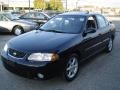 Blackout Black - Sentra SE Photo No. 1