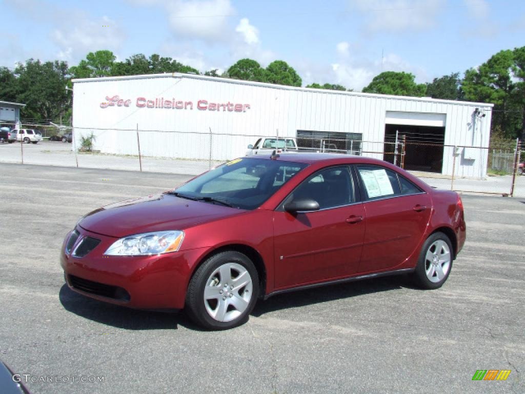 2009 G6 Sedan - Performance Red Metallic / Ebony photo #1
