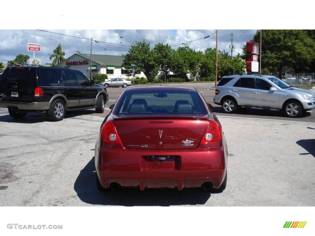 2009 G6 GXP Sedan - Performance Red Metallic / Ebony photo #4