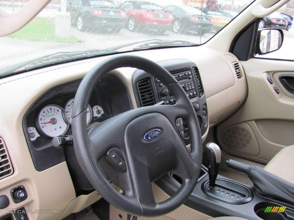 2006 Escape XLS 4WD - Blazing Copper Metallic / Medium/Dark Pebble photo #7