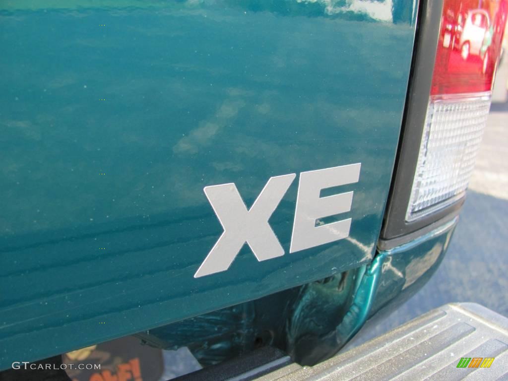 1997 Hardbody Truck XE Regular Cab 4x4 - Vivid Teal Pearl Metallic / Dark Gray photo #5