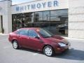 2007 Dark Toreador Red Metallic Ford Focus ZX4 SE Sedan  photo #1