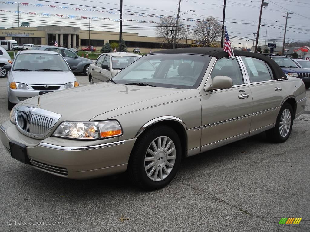 Pueblo Gold Metallic Lincoln Town Car