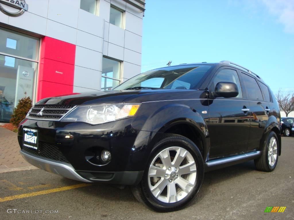 2009 Outlander SE 4WD - Labrador Black Pearl / Black photo #1