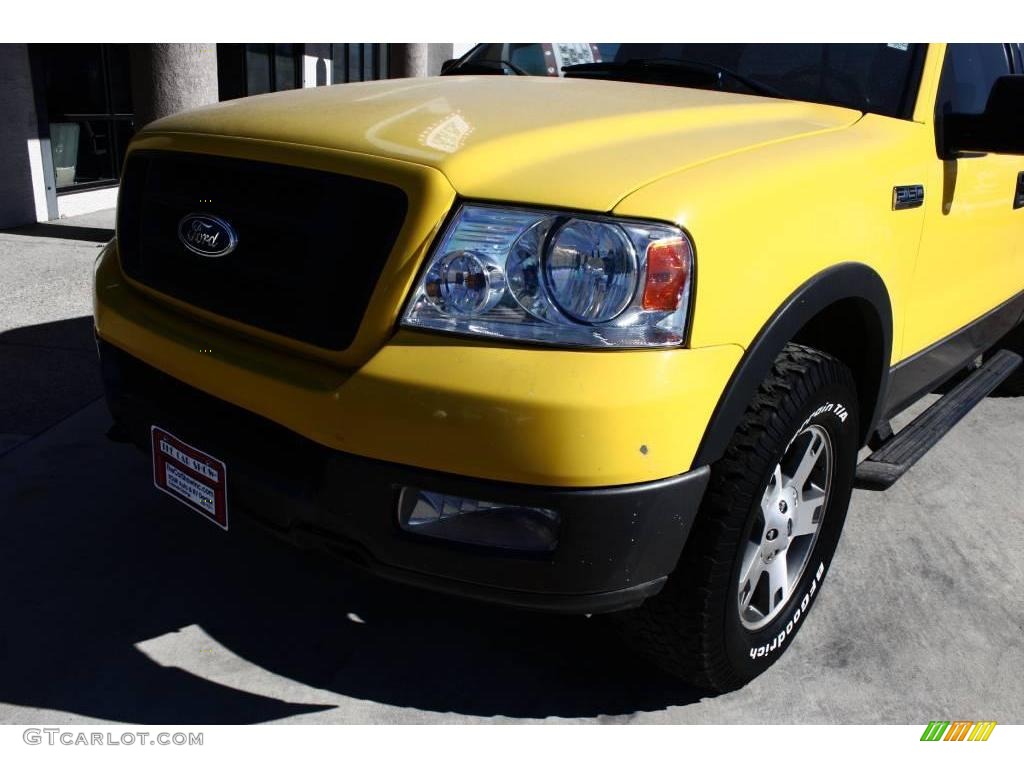 2004 F150 FX4 SuperCab 4x4 - Blazing Yellow / Black/Medium Flint photo #16