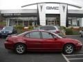 2000 Bright Red Pontiac Grand Prix GT Sedan  photo #1