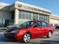 2005 Sangria Red Metallic Ford Focus ZX4 SES Sedan  photo #1