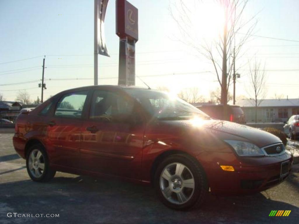 2005 Focus ZX4 SES Sedan - Sangria Red Metallic / Dark Flint/Light Flint photo #3
