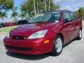 2002 Sangria Red Metallic Ford Focus SE Sedan  photo #7