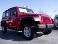 2010 Flame Red Jeep Wrangler Unlimited Sport 4x4  photo #4