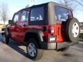 2010 Flame Red Jeep Wrangler Unlimited Sport 4x4  photo #2