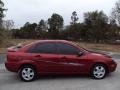 2005 Sangria Red Metallic Ford Focus ZX4 SES Sedan  photo #9