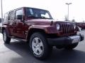 2010 Red Rock Crystal Pearl Jeep Wrangler Unlimited Sahara  photo #4
