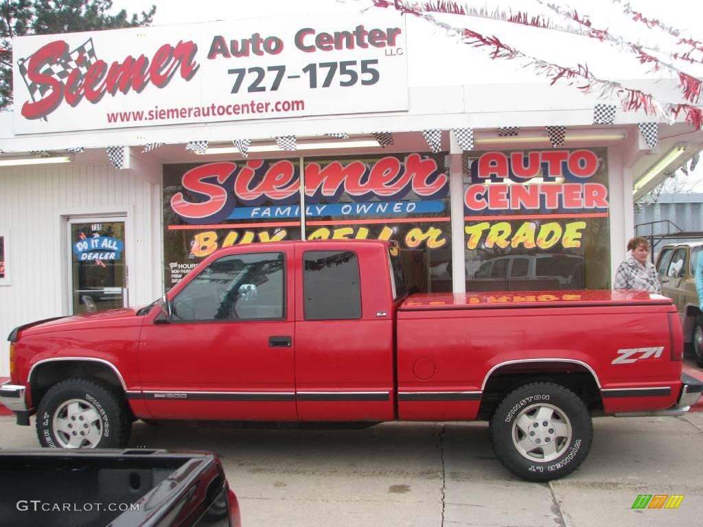 1994 Sierra 1500 SLE Extended Cab 4x4 - Fire Red / Gray photo #1