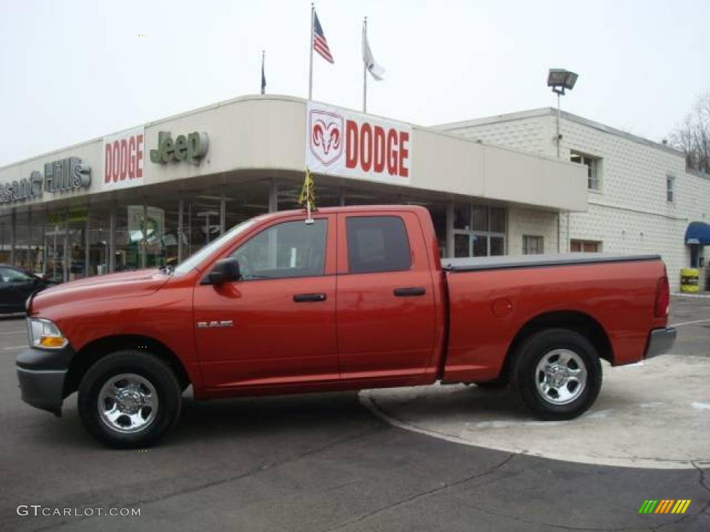 2009 Ram 1500 SLT Quad Cab 4x4 - Sunburst Orange Pearl / Dark Slate/Medium Graystone photo #1