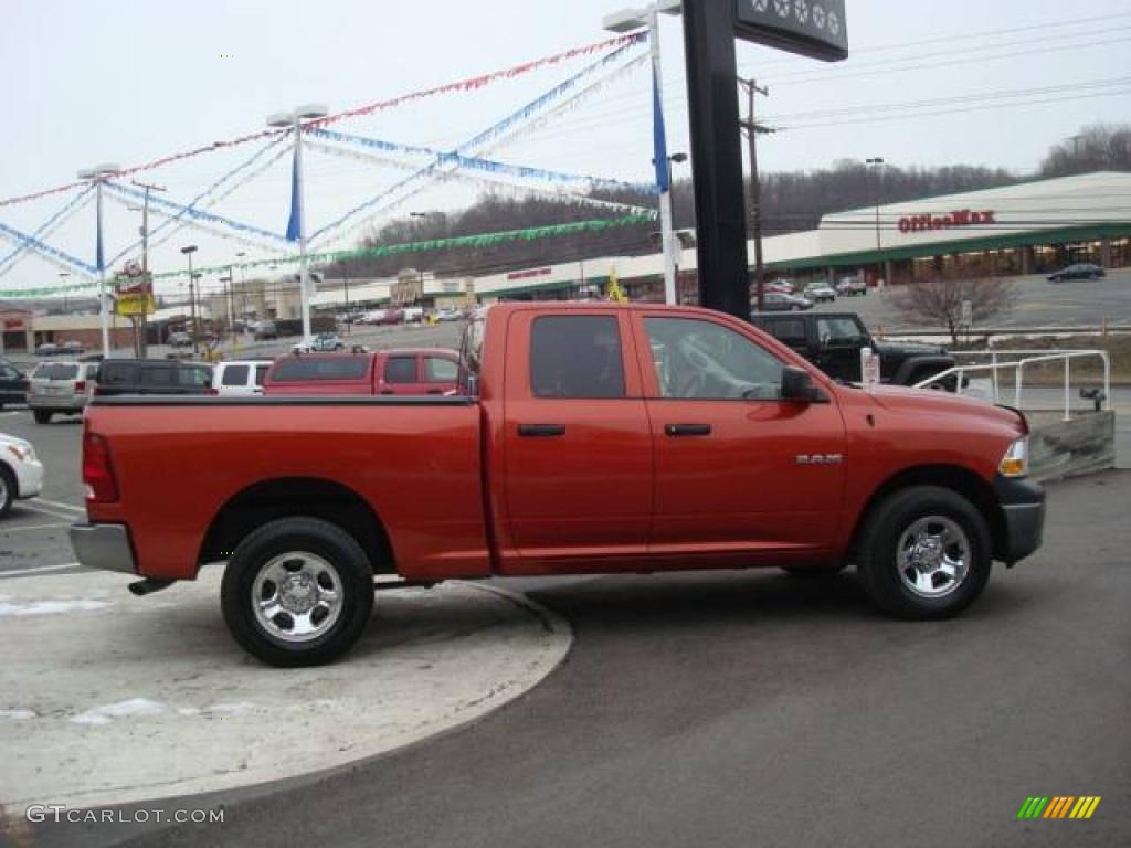 2009 Ram 1500 SLT Quad Cab 4x4 - Sunburst Orange Pearl / Dark Slate/Medium Graystone photo #5