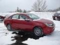 2010 Sangria Red Metallic Ford Focus SES Sedan  photo #1