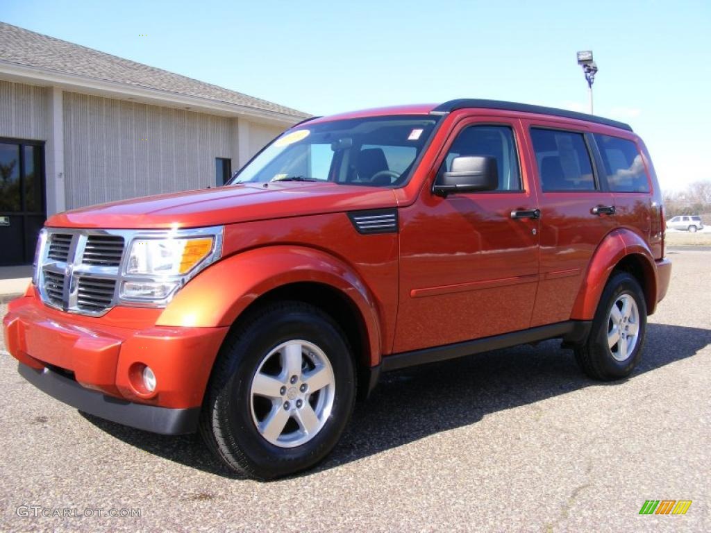 2009 Nitro SE 4x4 - Sunburst Orange Pearl / Dark Slate Gray photo #1